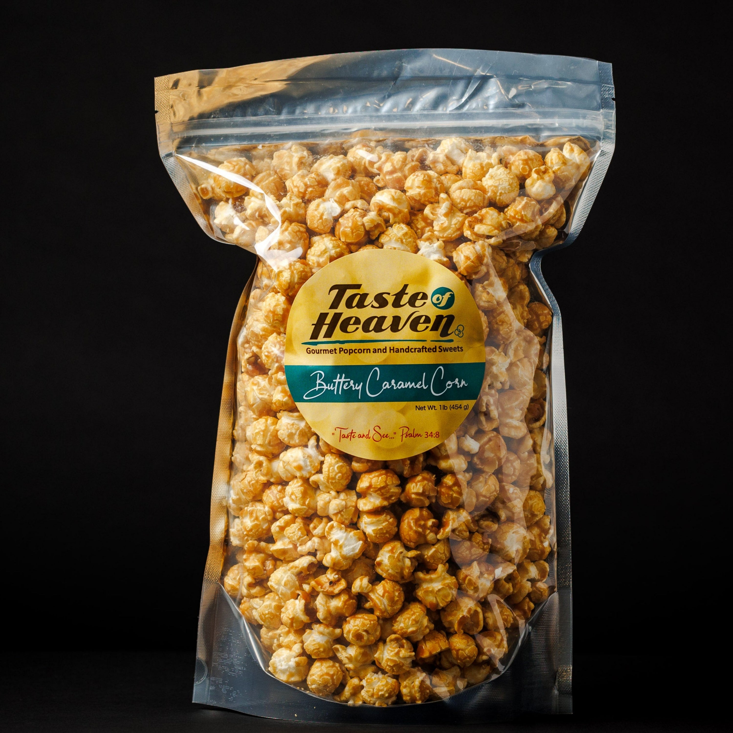 A clear plastic stand-up pouch filled with buttery caramel corn, featuring a round yellow and green Taste Heaven label, set against a solid black background.